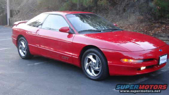 Red Ford Probe GT parked outside