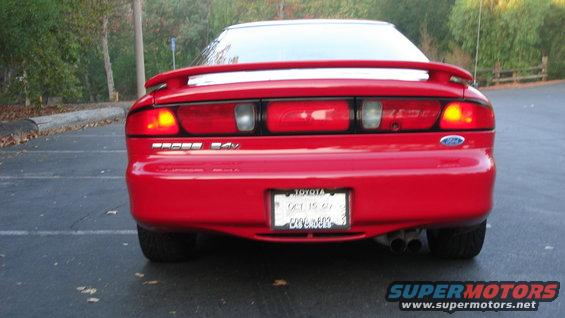 1996 Ford Probe rear view, red paint, spoiler, dual exhaust pipes