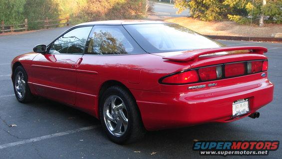 Red 1996 Ford Probe GT parked outside
