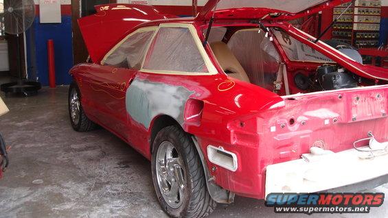 Fixing the damage on both quarter panels.