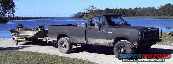 33460038a.jpg June 21, 2007 - John's 1979 Dodge Powerwagon with duck/fishing boat near Fletcher's Floodwaters. Wyoming ranch truck. Came to Michigan in 2005. This is after doing body work and new paint to Olive Drab in 2006 ourselves. Sanding, bondo where needed (not much), more sanding, primer and paint was done in one weekend.