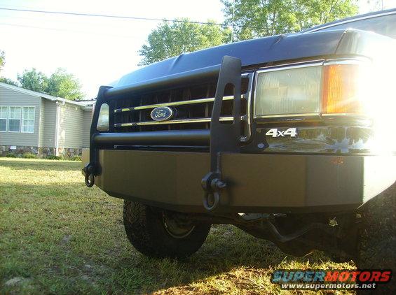 Black 1990 Ford Bronco front with brush guard and 4x4 badge