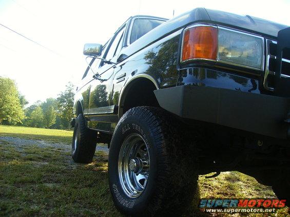 Black Ford Bronco, front quarter view, lifted with off-road tires