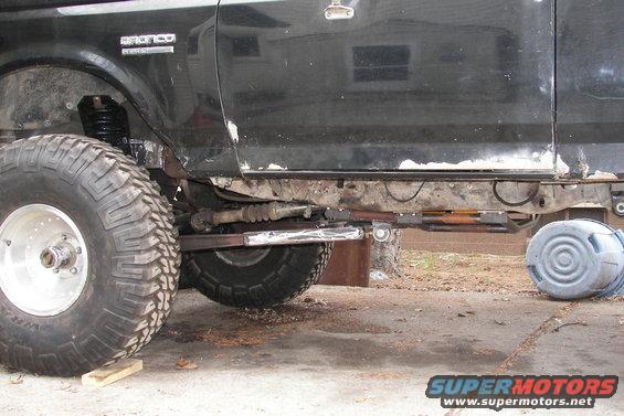 Black 1988 Ford Bronco side view, showing lifted suspension and large tires