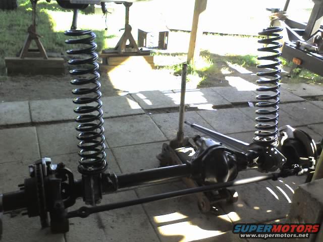 Front axle with coil springs and suspension components