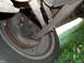 1966 Ford Mustang - Underside view of a vehicle's front suspension system and tire.