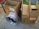 1966 Ford Mustang - A single chrome wheel is shown next to several cardboard boxes, one labeled 'Specialty Wheels Ltd.'
