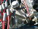 1966 Ford Mustang - A close-up view of an engine's intake manifold, showing spark plug wires and associated engine components.