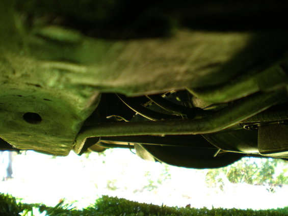 Underside view of vehicle suspension and exhaust system