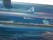 1978 Ford Bronco - A detailed mural depicts a naval scene with fighter jets, an aircraft carrier, and other warships sailing on the ocean.