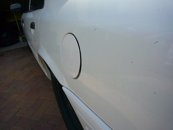 White 2001 Ford Crown Victoria side view showing fuel door