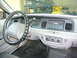 2001 Ford Crown Victoria - The interior of a 2001 Ford Crown Victoria, the dashboard, steering wheel, and radio controls.