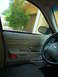 2001 Ford Crown Victoria - Interior view of a 2001 Ford Crown Victoria, capturing the door panel and steering wheel.