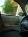 2001 Ford Crown Victoria - Interior view of a 2001 Ford Crown Victoria, showing the driver's side door panel and steering wheel.