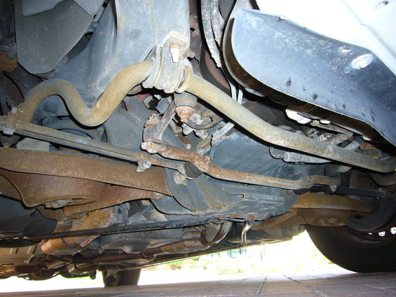 Undercarriage view showing suspension components and exhaust system