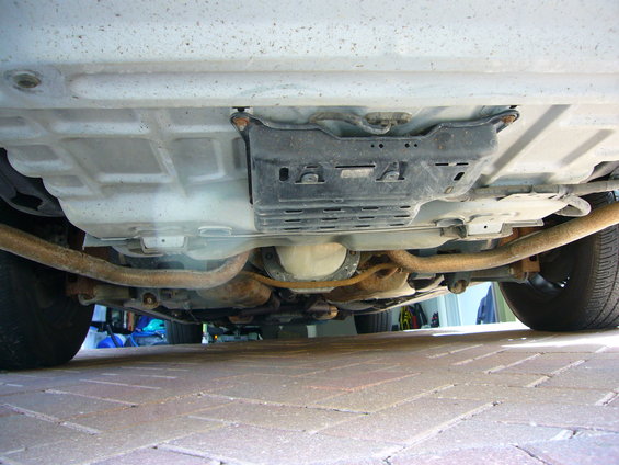 Underside view of a 2001 Ford Crown Victoria showing the rear differential, exhaust system, and frame