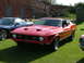 1988 Ford Sport - Front view of a red 1971 Ford Mustang Mach 1 with a blue car beside it.