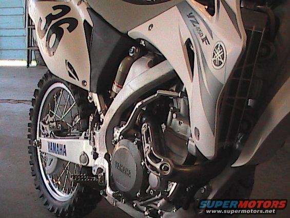 White Yamaha YZ450F dirt bike, side view, with number 36