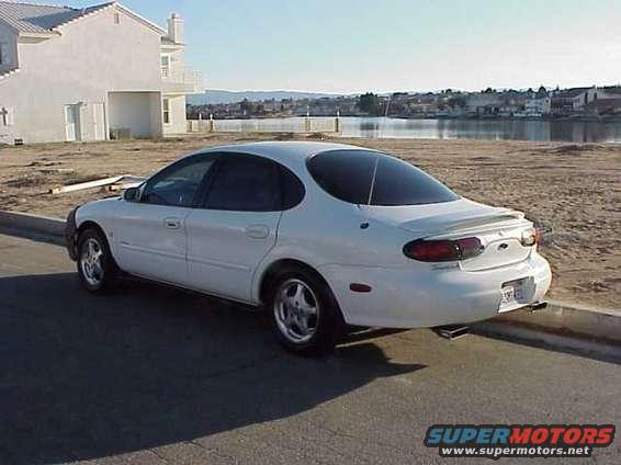 1999 Ford Taurus sedan parked on street, rear view