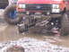 1989 Ford Bronco - This truck appears to be stuck in the mud, with its front suspension clearly visible in the murky water.