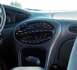 1999 Ford Taurus - Interior view of a car's dashboard, showing the center console with radio and climate controls.