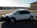 1999 Ford Taurus - This 1999 Ford Taurus is captured from the side, a black car bra on the front end.