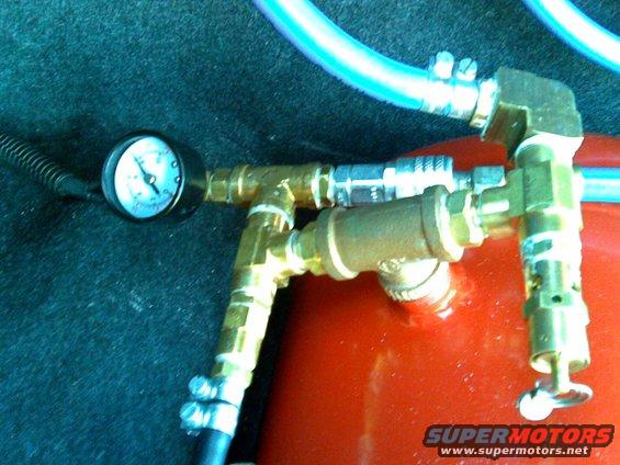 safety blow-off valve and a quick disconnect for airing tires or running tools. high/low pressure switch cuts off at about 112psi and on at 80psi.