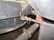 1989 Ford Bronco - Detail shot of a vehicle's undercarriage, focusing on the frame and suspension components.