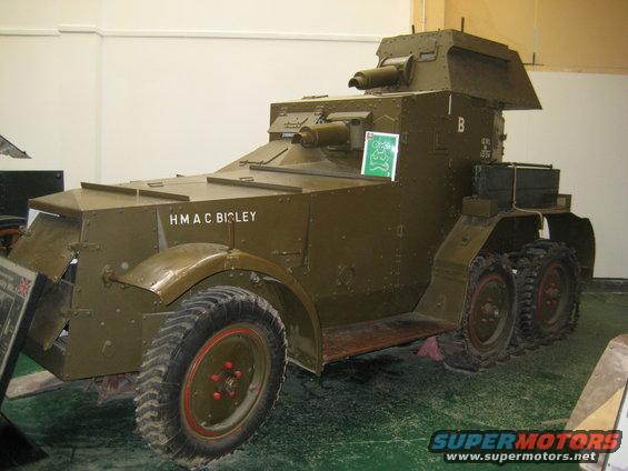 Green armored car with "HMAC BICLEY" painted on the side and two turrets