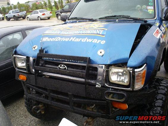 Blue Toyota 4Runner front view with hood decals and aftermarket bumper