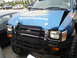 1994 Ford F-250 - This blue Toyota 4Runner features prominent hood decals and a heavy-duty aftermarket bumper.