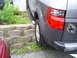 1994 Ford F-250 - Rear view of a Honda Element with a Wyoming sticker, parked near a retaining wall.