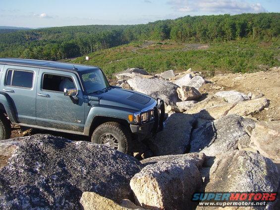 Hummer H3 navigating a rocky trail