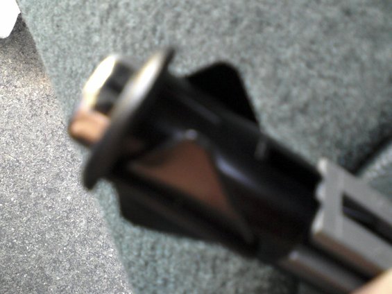 1001071615.jpg A close up of the mounting tabs used on both the fuel and trunk door release switches. It is a very thin plastic.