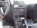 1994 Ford Probe - Interior view of a 1994 Ford Probe, highlighting the dashboard and center console features.