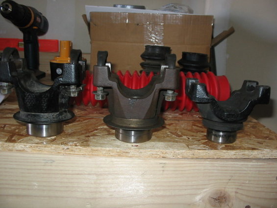 114_1430.jpg left to right (2) 1356 front ouput yokes, and (1) 1330 series D44 spicer front axle yoke.

Also have a stock '95 bronco front driveshaft, with spare and new Ujoint., rust free shaft.

All yokes $25ea , driveshaft $40, ujoint included.  all items + shipping.