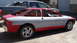 1996 Ford Probe - This red and gray car, possibly a Ford Probe, is seen from the side with its windows and doors removed, indicating it is in a state of repa…
