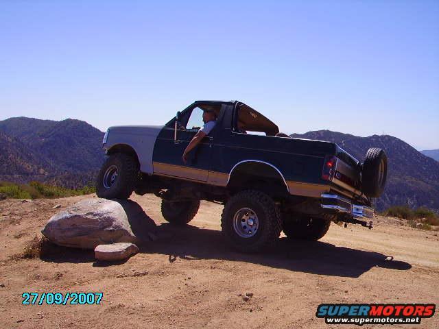 Cleghorn, William owning a rock in his Bronco, 6" lift 35" tires