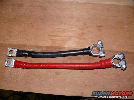Two battery cables, one red and one black, with terminal clamps