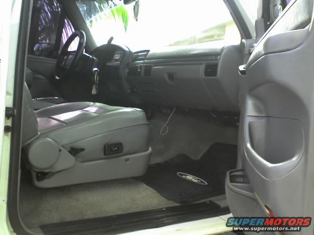 1995 Ford Bronco interior showing driver's seat, dashboard, and door panel