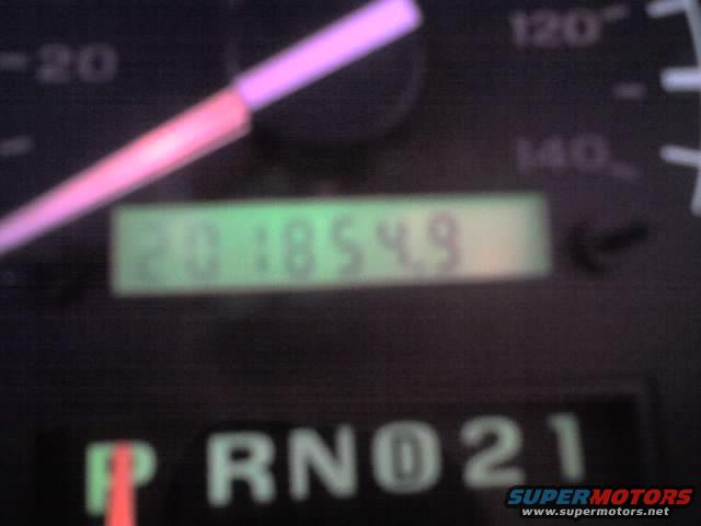 Vehicle dashboard with speedometer, odometer reading 201854.9, and gear selector showing P R N D 2 1