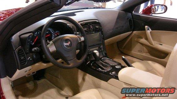 Corvette interior with tan seats, black dashboard, and infotainment screen