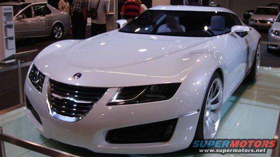 White concept car with a prominent grille and headlights on display