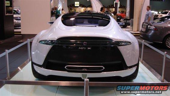 White concept car with black rear panel labeled "Aero X". Another car is visible to the right