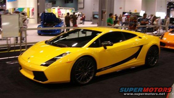 Yellow sports car with black accents, 3/4 front view