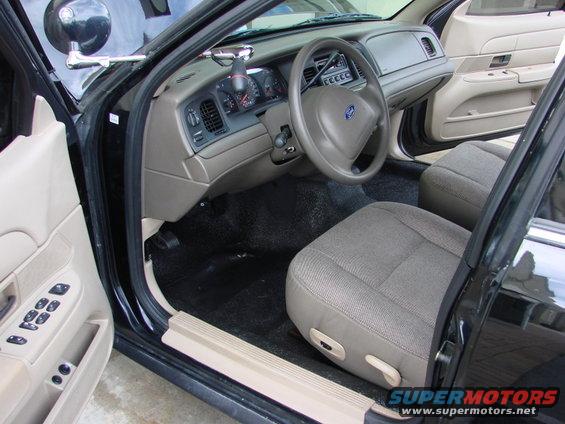 Interior view of a 1998 Ford Crown Victoria showing the dashboard, steering wheel, and seats