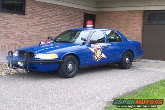 2003 Ford Crown Victoria Michigan State Police car parked in driveway