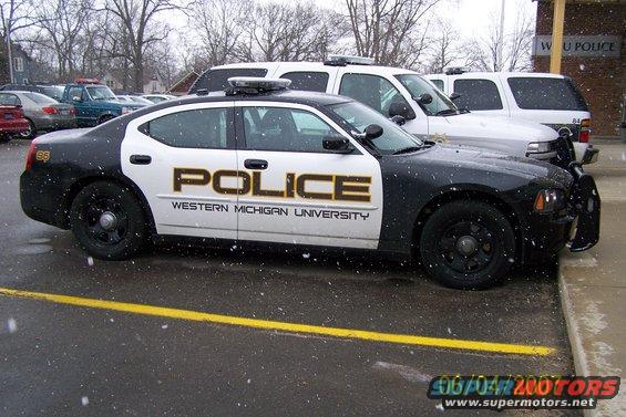 Western Michigan University police car parked next to other vehicles