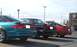 1989 Mazda MX-6 - Three 1989 Mazda MX-6s are parked in a lot with a Starbucks drive-thru visible.