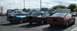 1989 Mazda MX-6 - Three coupes are parked in a lot. The red car appears to be a 1989 Ford Probe.